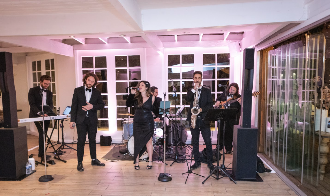 Sunny Jazz Band full 7-piece lineup performing at Casa del Mar Santa Monica with vocalist, saxophone, keys, bass, drums and guitar