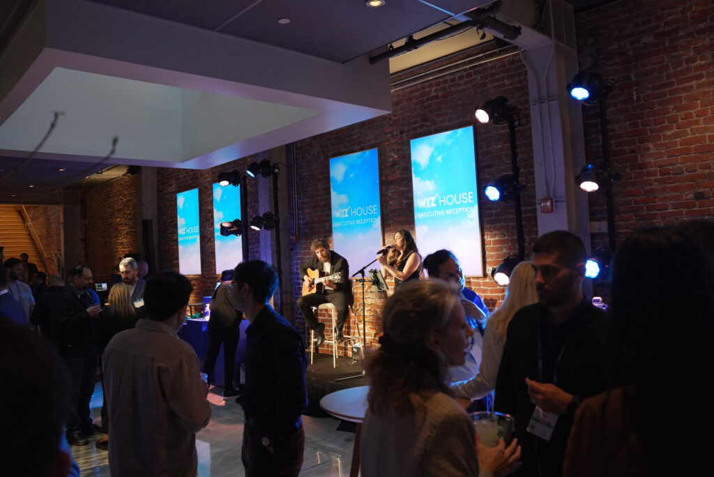 Sunny Jazz Band jazz duo with vocalist and guitarist performing live at a Los Angeles corporate reception